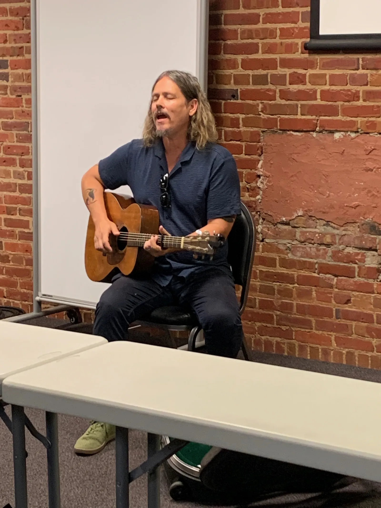 A guitar player sings #3