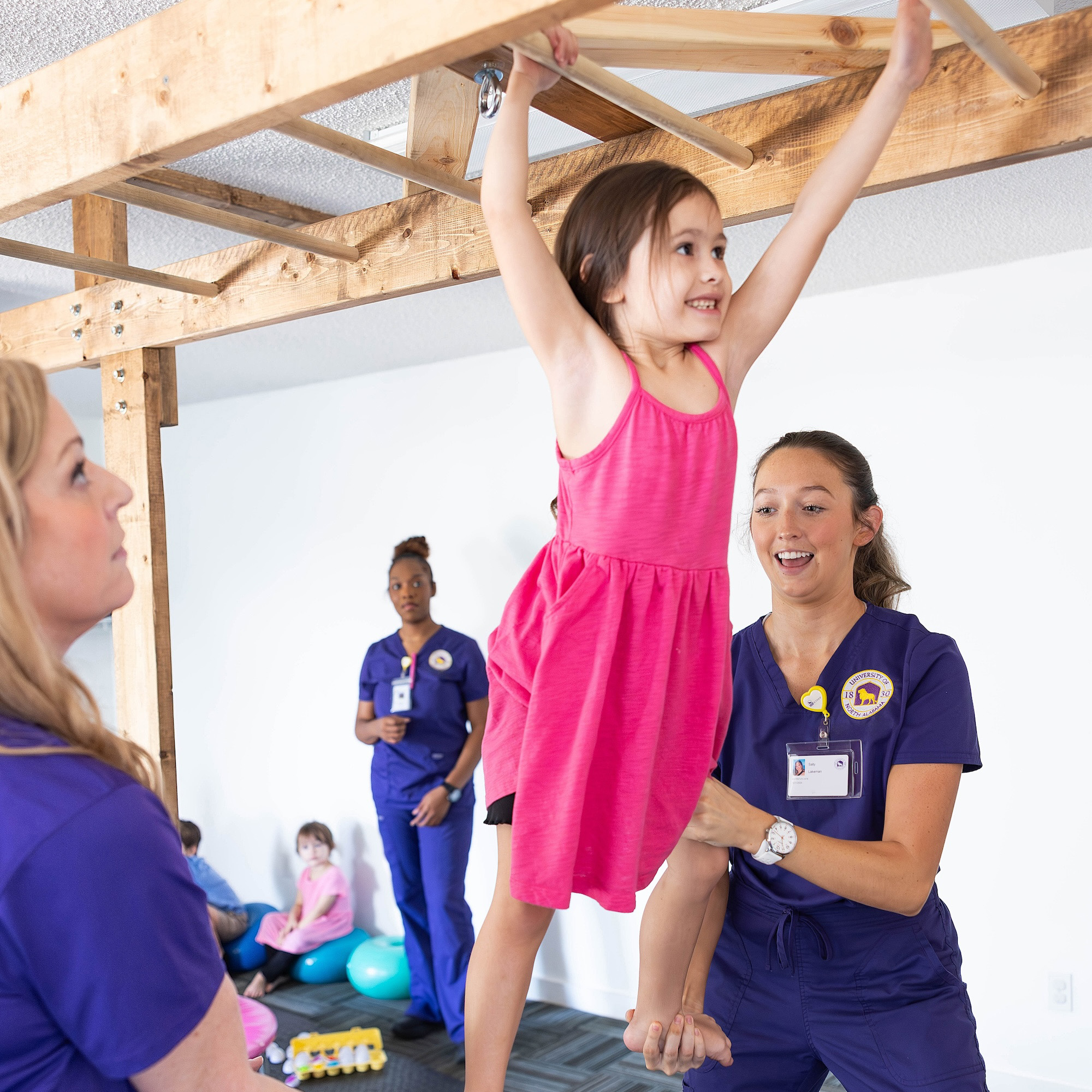 girl playing on monkey bars